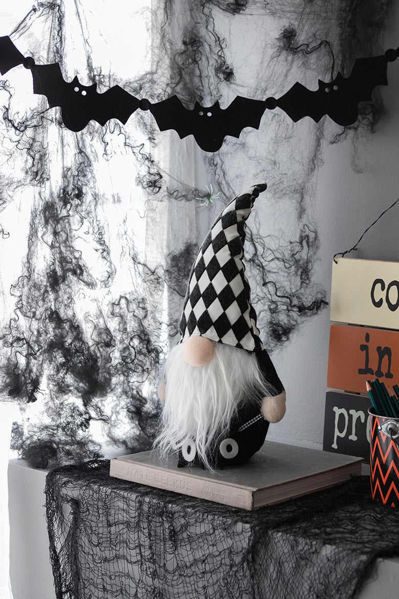 Black and white checkered gnome with a long white beard ideal for Halloween decor