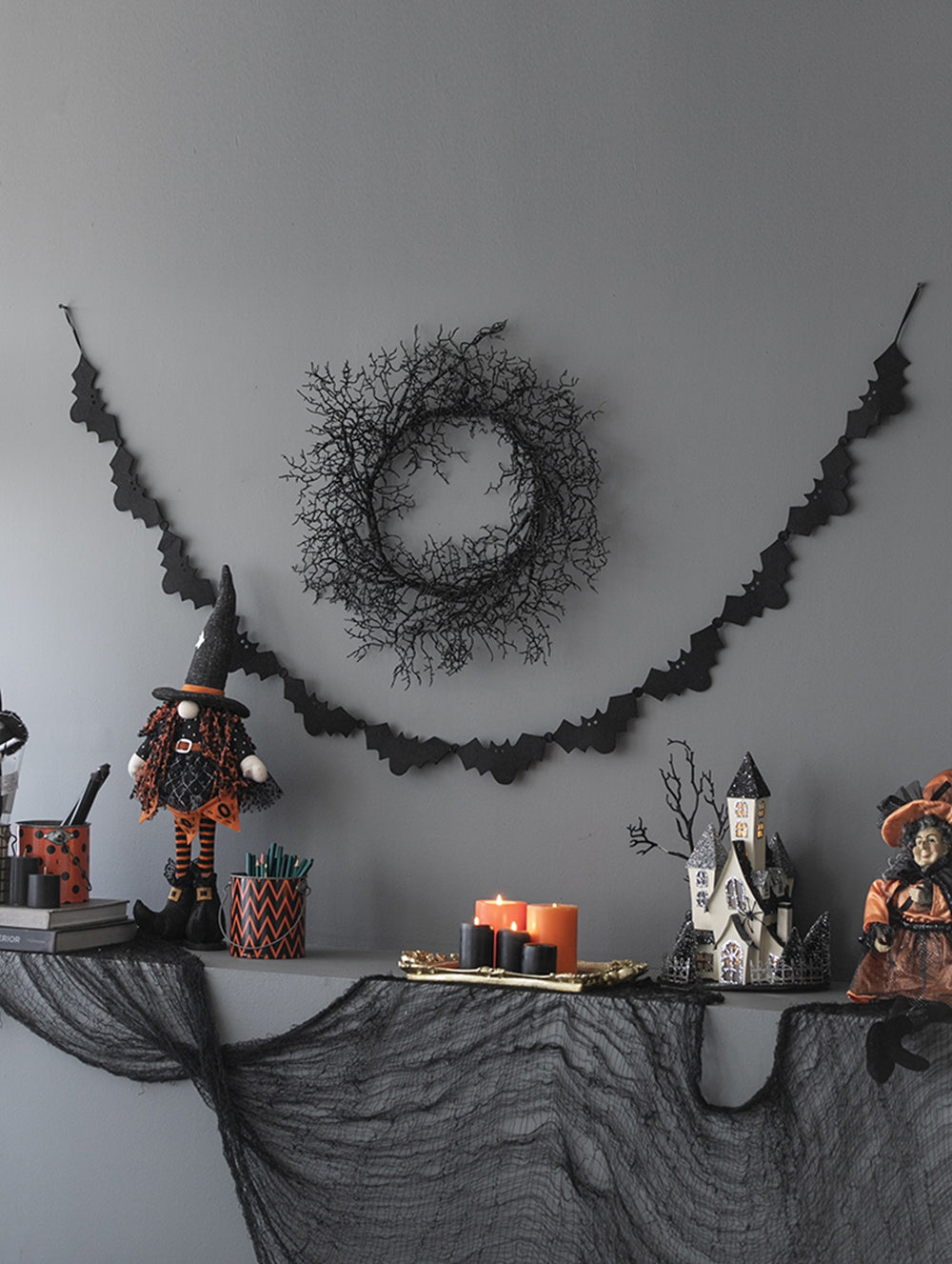 Black twig wreath with bat garland for Halloween decor