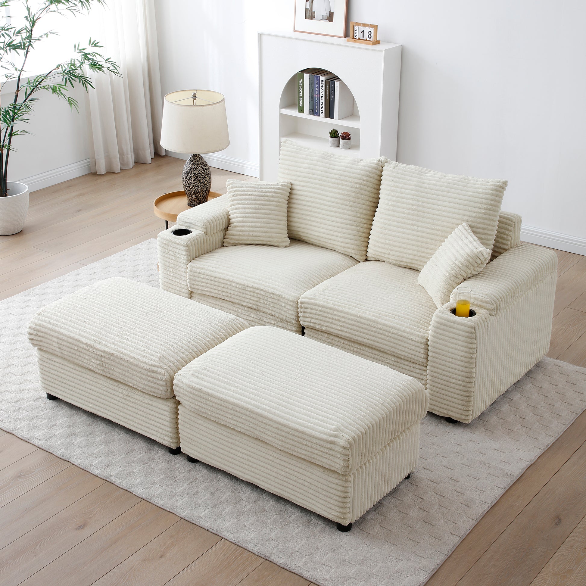 Cream corduroy sectional sofa with two ottomans and builtin cup holders