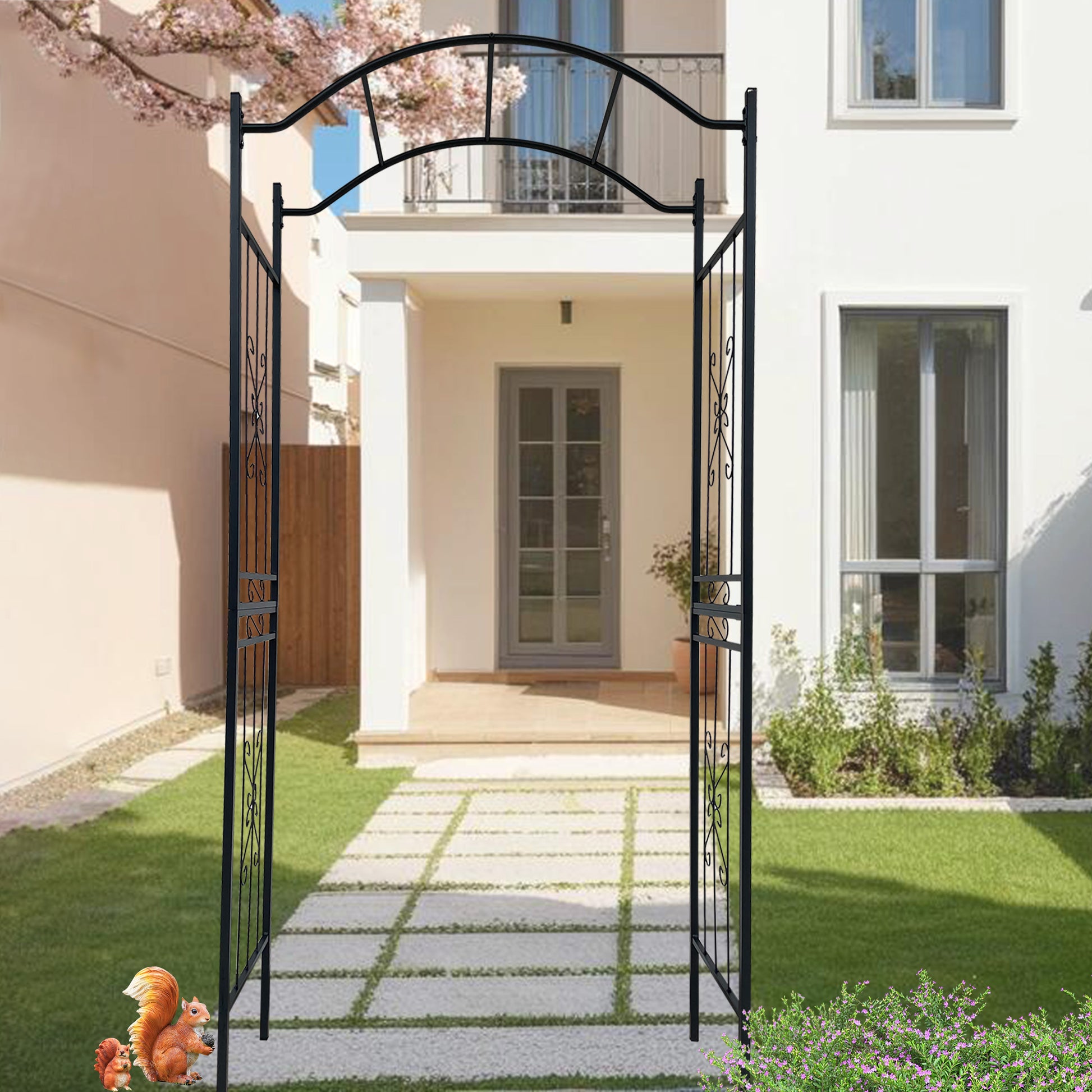 Black metal garden arch with decorative scrolls perfect for a romantic wedding arch