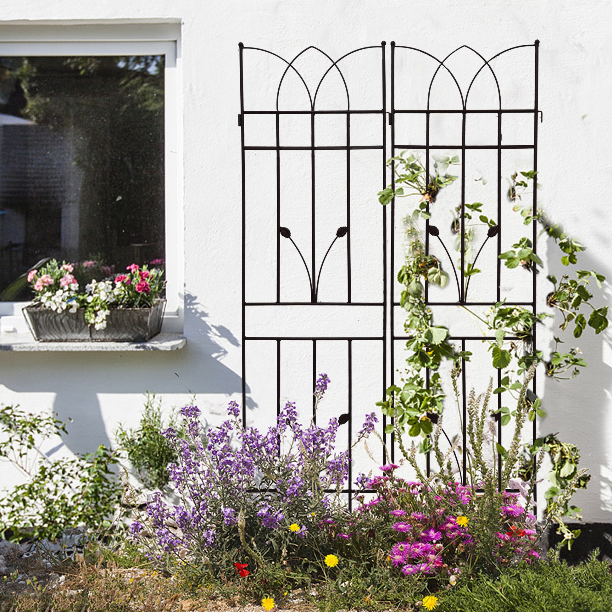 Black wrought iron garden trellis with decorative arch top ideal for climbing plants