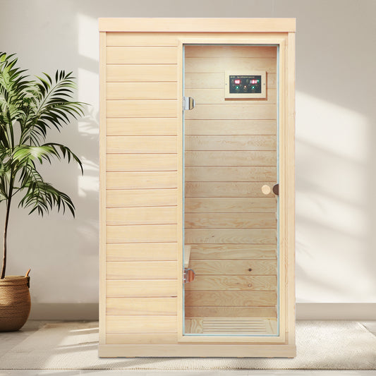 Compact far infrared sauna with wooden paneling and glass door