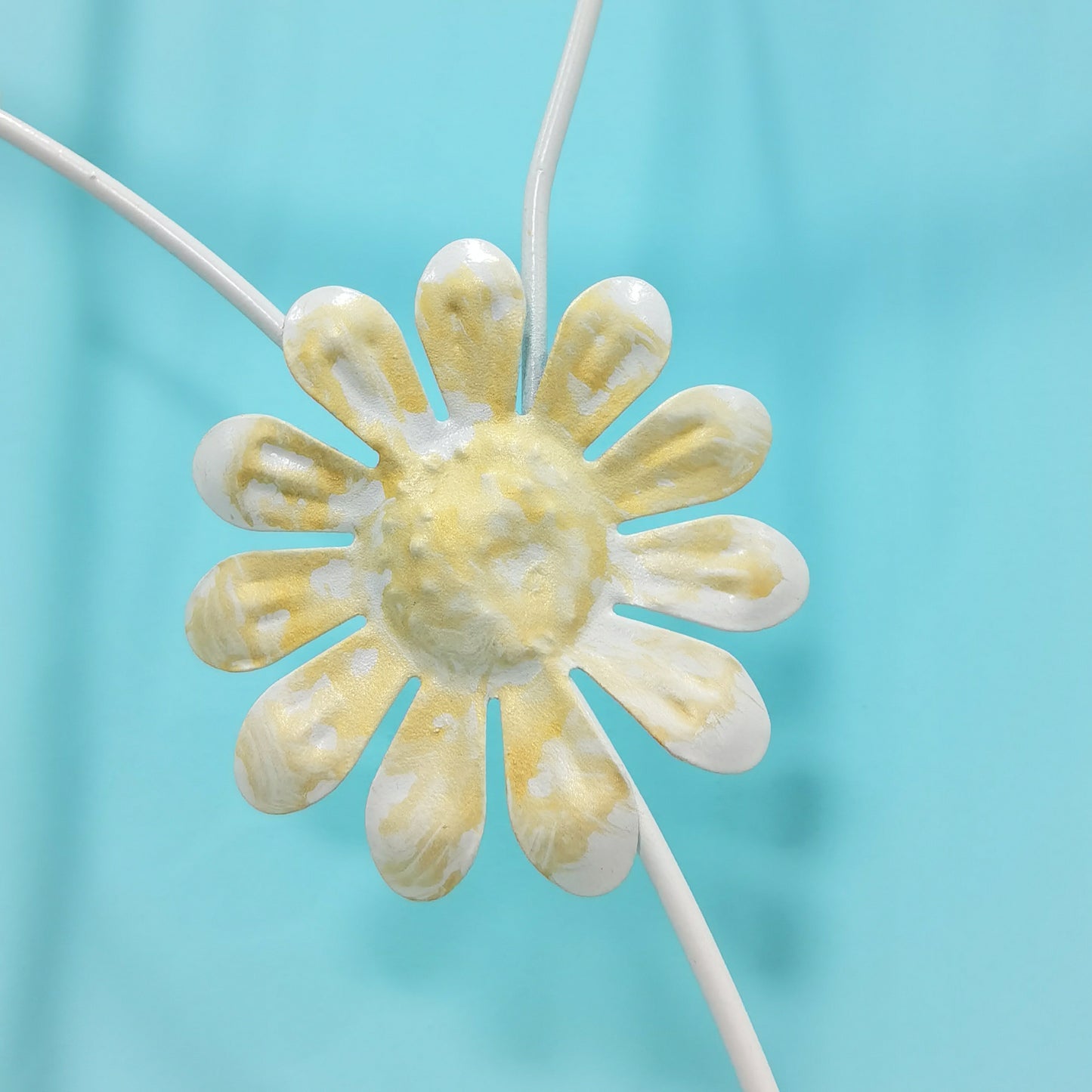 White and gold metal daisy embellishment with textured petals