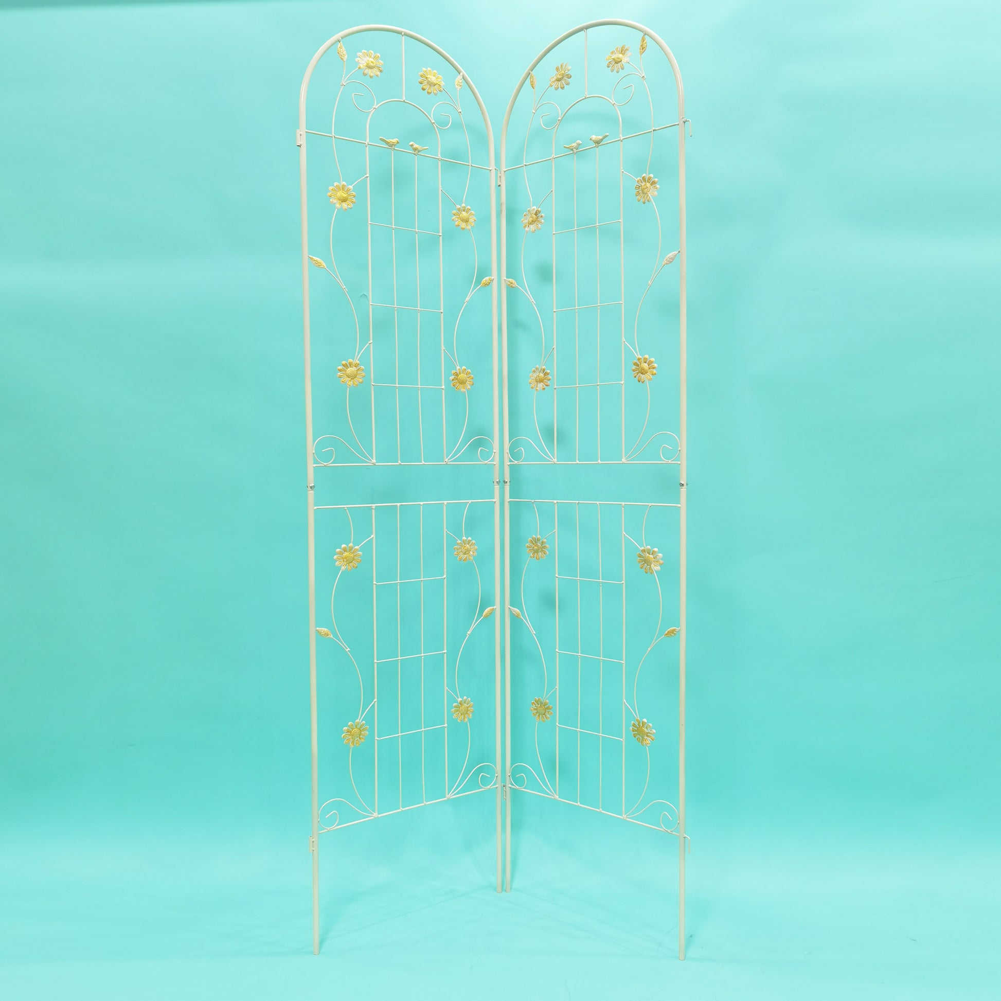 Decorative white metal garden trellis with floral accents ideal for climbing plants