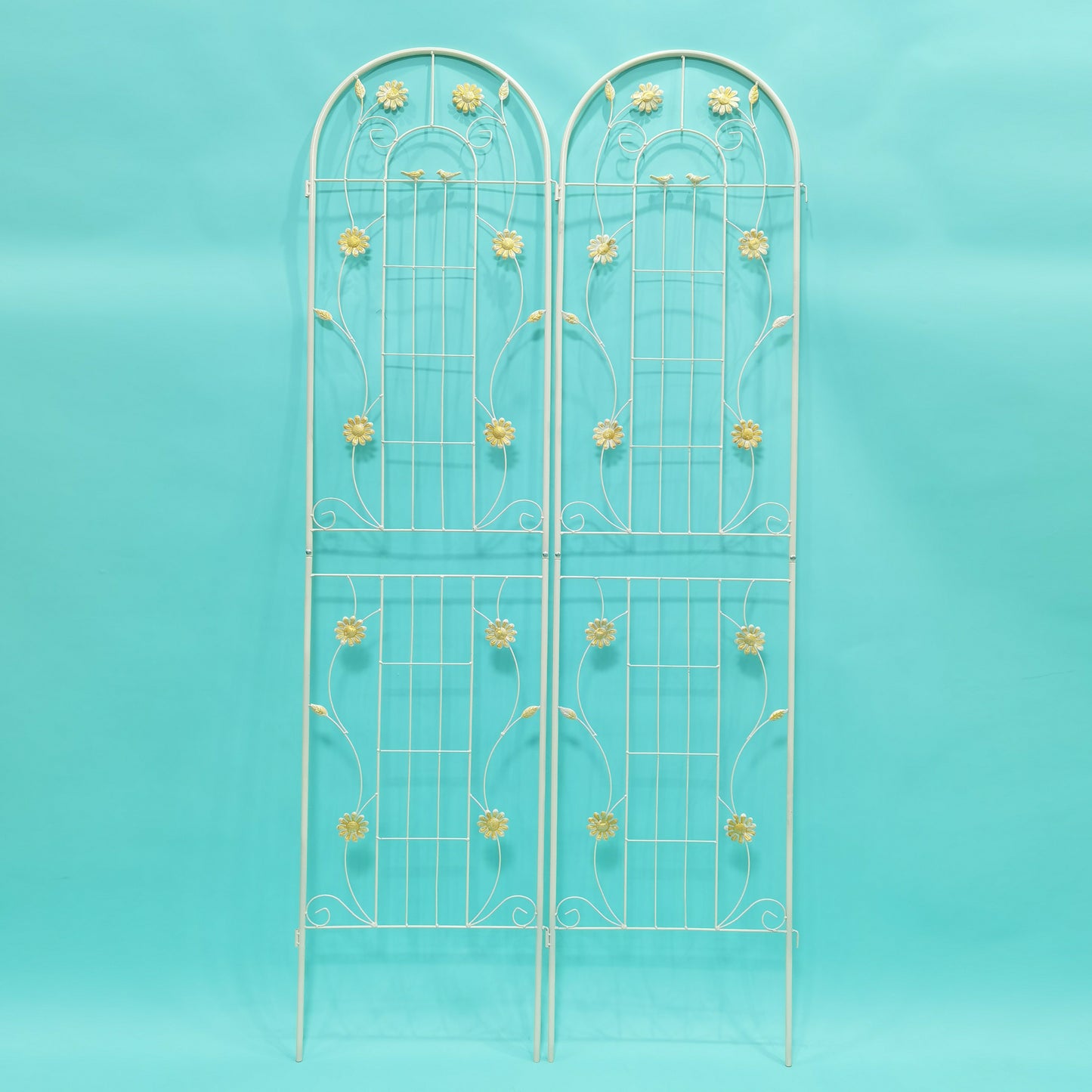 Cream metal garden trellis with floral accents and arched top perfect for climbing plants