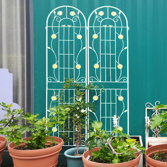 Ornate white metal garden trellis with floral details and birds ideal for climbing plants
