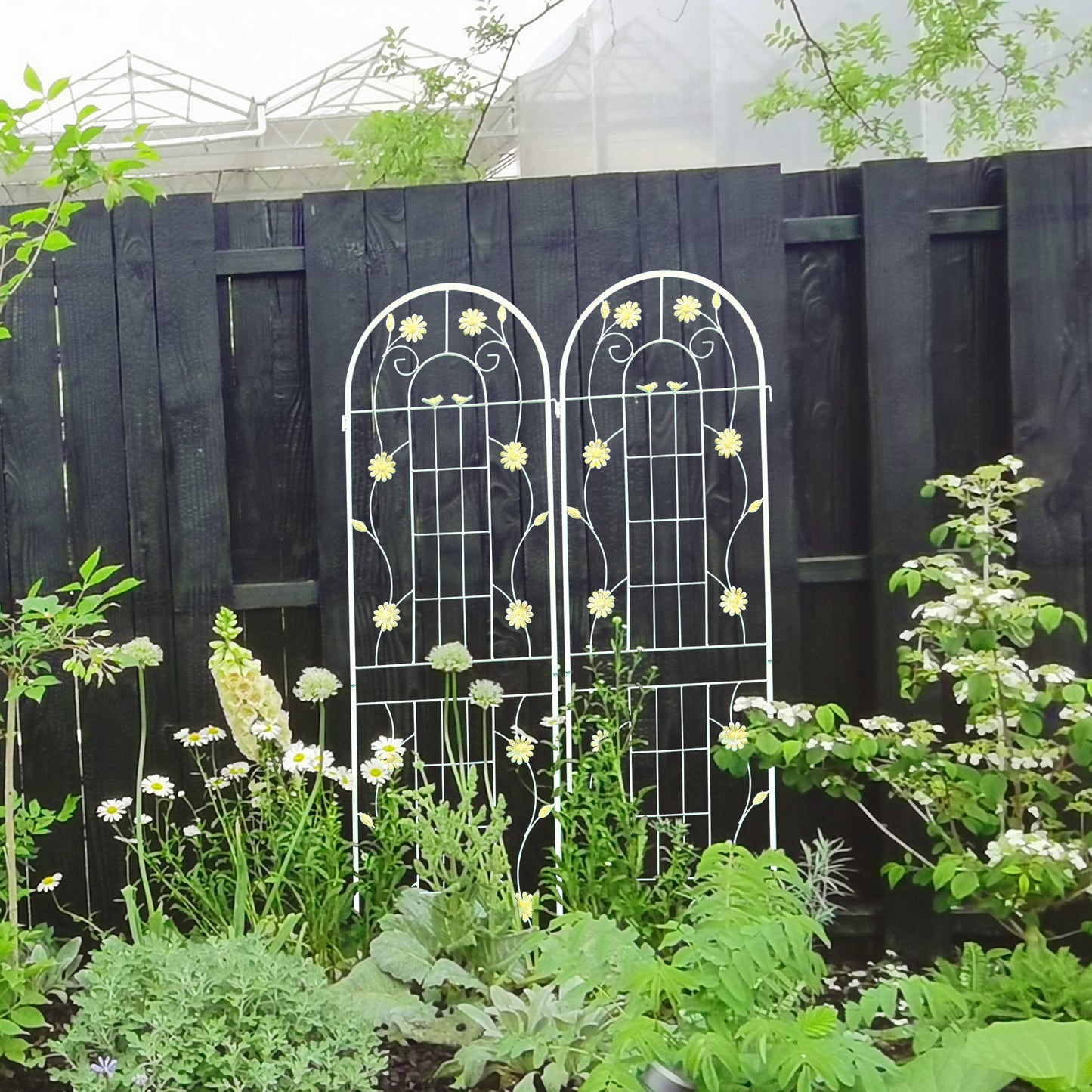 White metal garden trellis with decorative yellow flowers and birds ideal for climbing plants