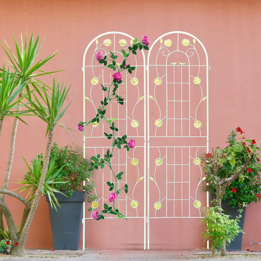 White metal garden trellis with arched top adorned with floral accents for climbing roses
