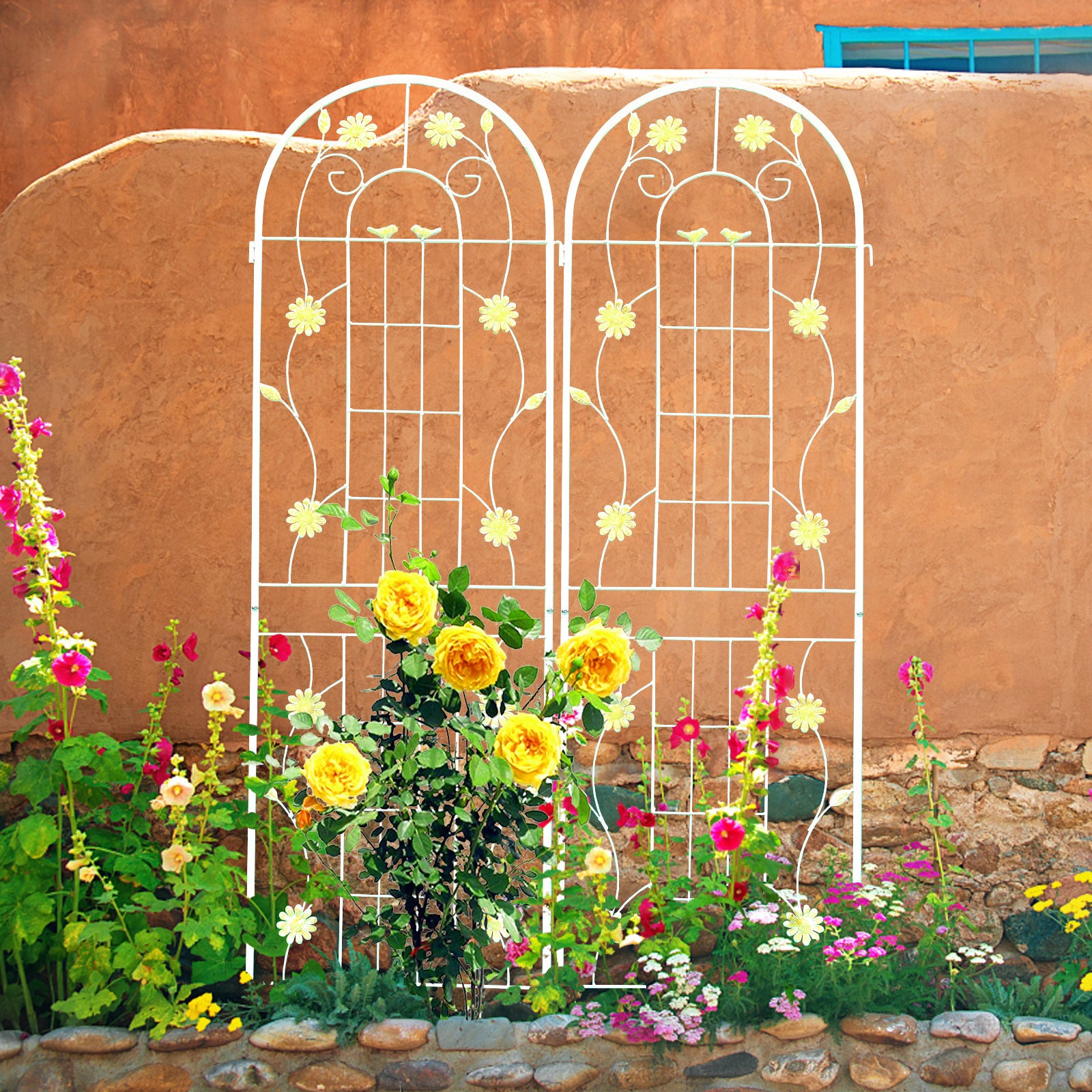 White metal garden trellis with decorative floral and bird motifs perfect for climbing plants