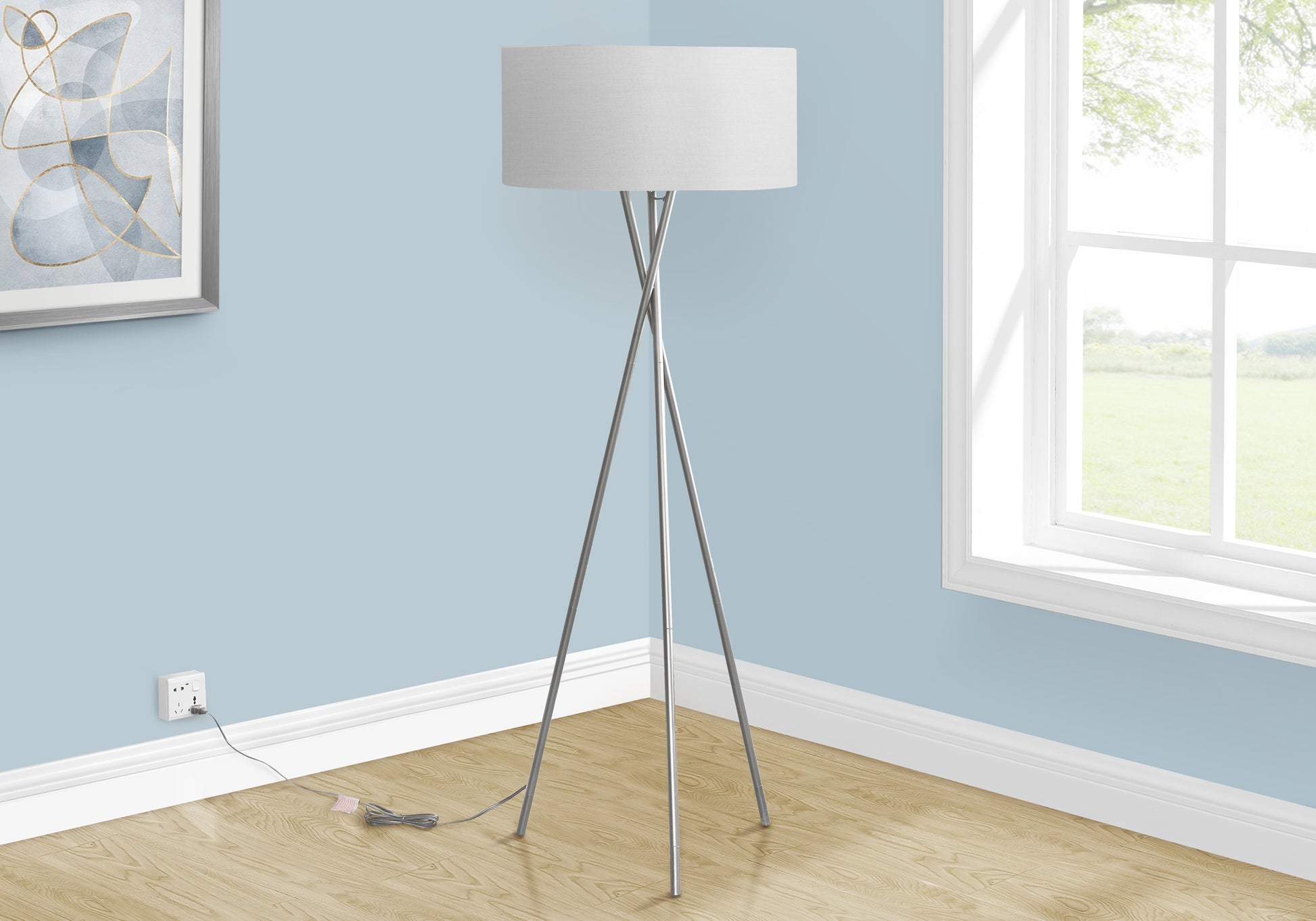 Modern tripod floor lamp with white drum shade and brushed nickel finish