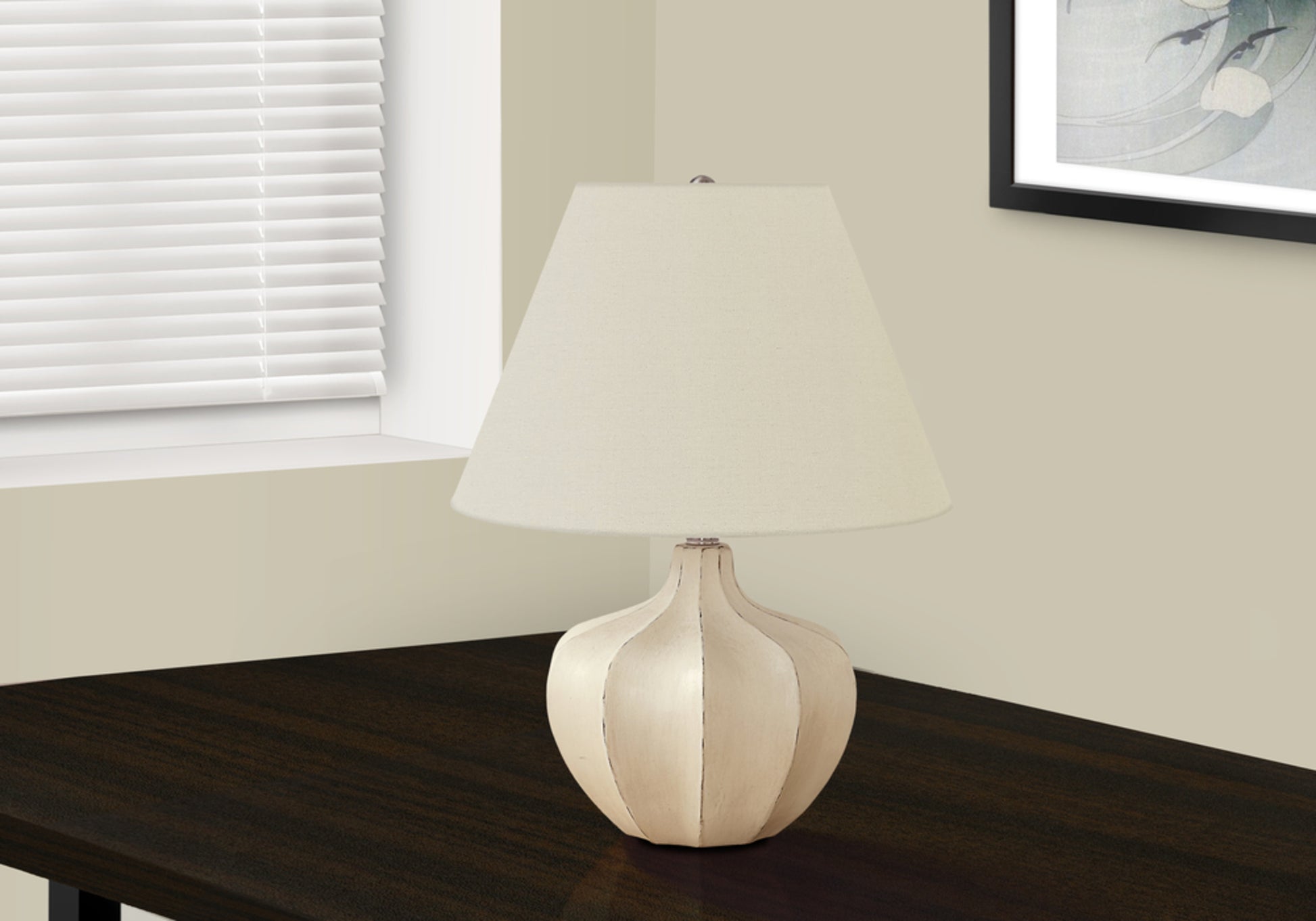 Cream fabric lampshade on a decorative ribbed ceramic base a stylish accent lamp for any room