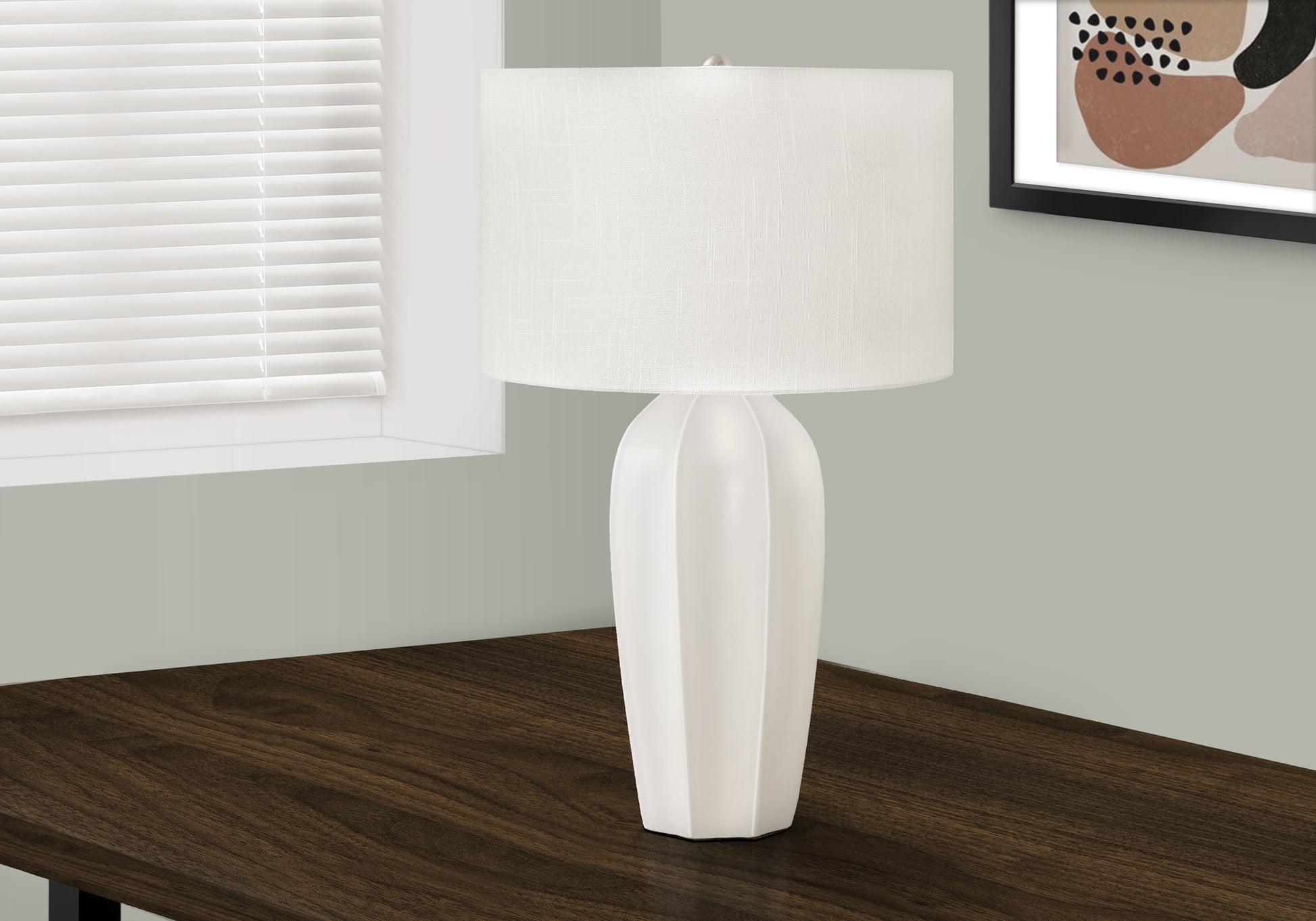 Modern white ceramic table lamp with a textured linen shade perfect for bedside tables