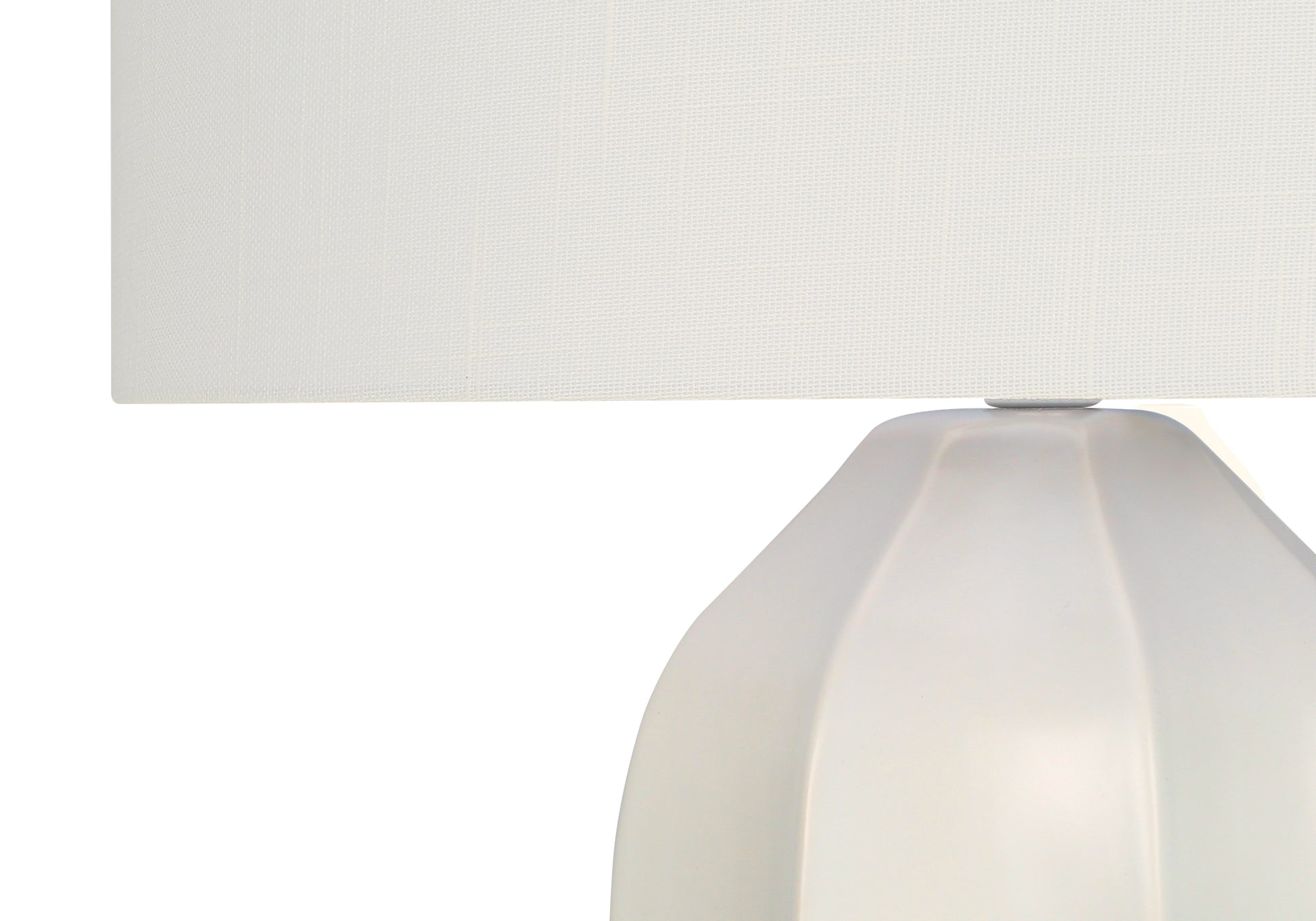 White ceramic table lamp with a textured fabric shade for modern living spaces