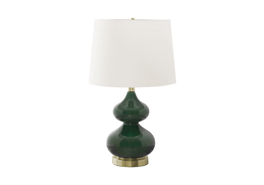 Emerald green glass table lamp with brass base and white shade