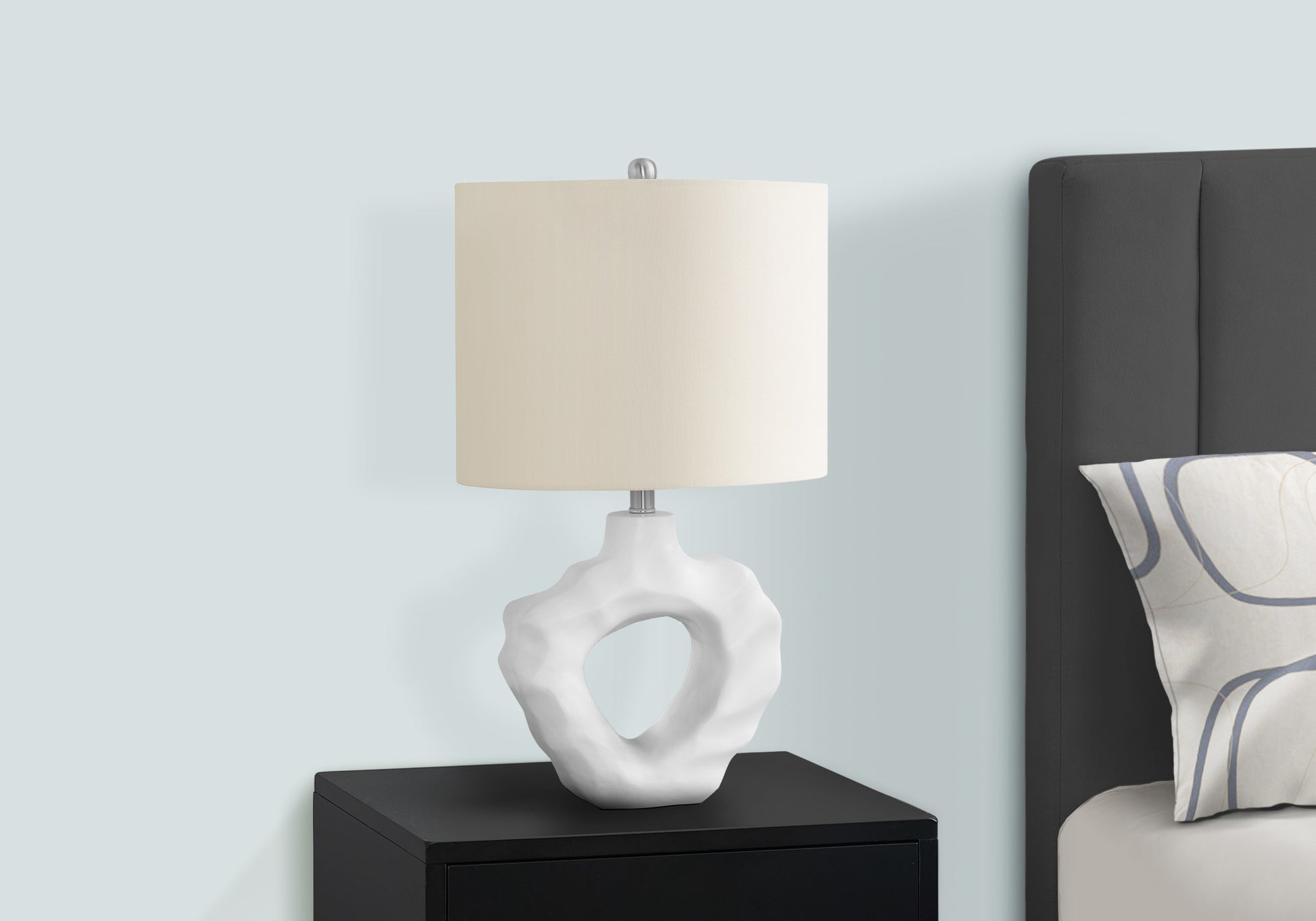 Modern white sculptural table lamp with offwhite drum shade ideal for bedroom decor