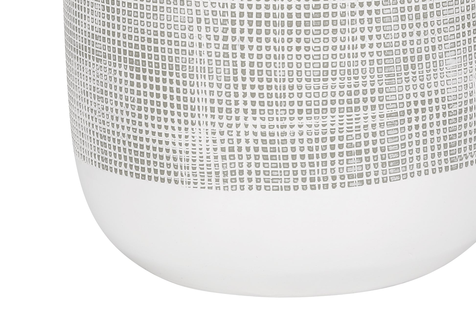 Closeup of a textured white ceramic vase with a subtle grey grid pattern