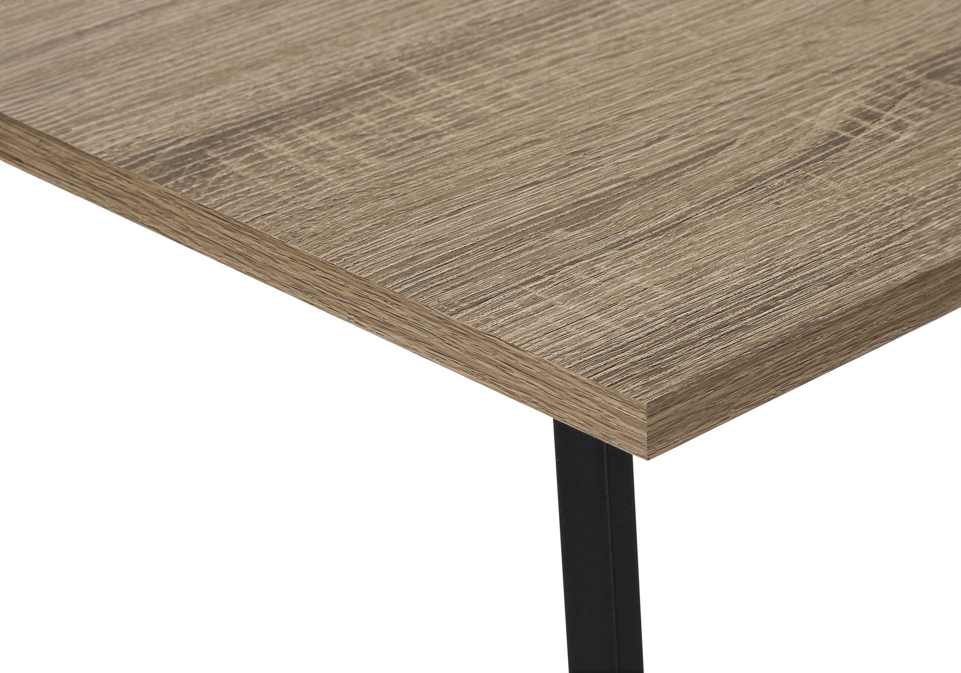 Closeup of a rustic oak veneer desk surface with clean lines and a black metal leg