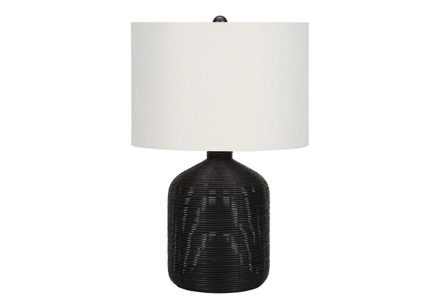 Woven black rattan base table lamp with white drum shade and natural texture