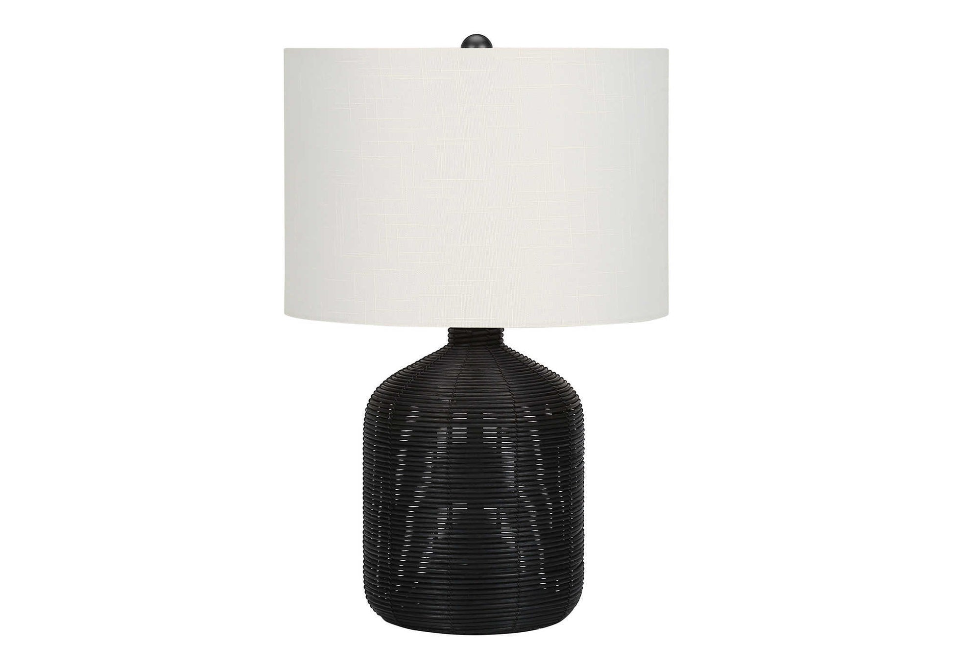 Woven black rattan base table lamp with white drum shade and natural texture