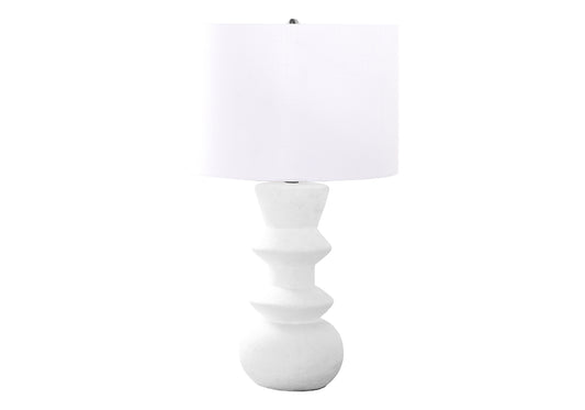 White textured table lamp with sculptural base and white drum shade for modern decor