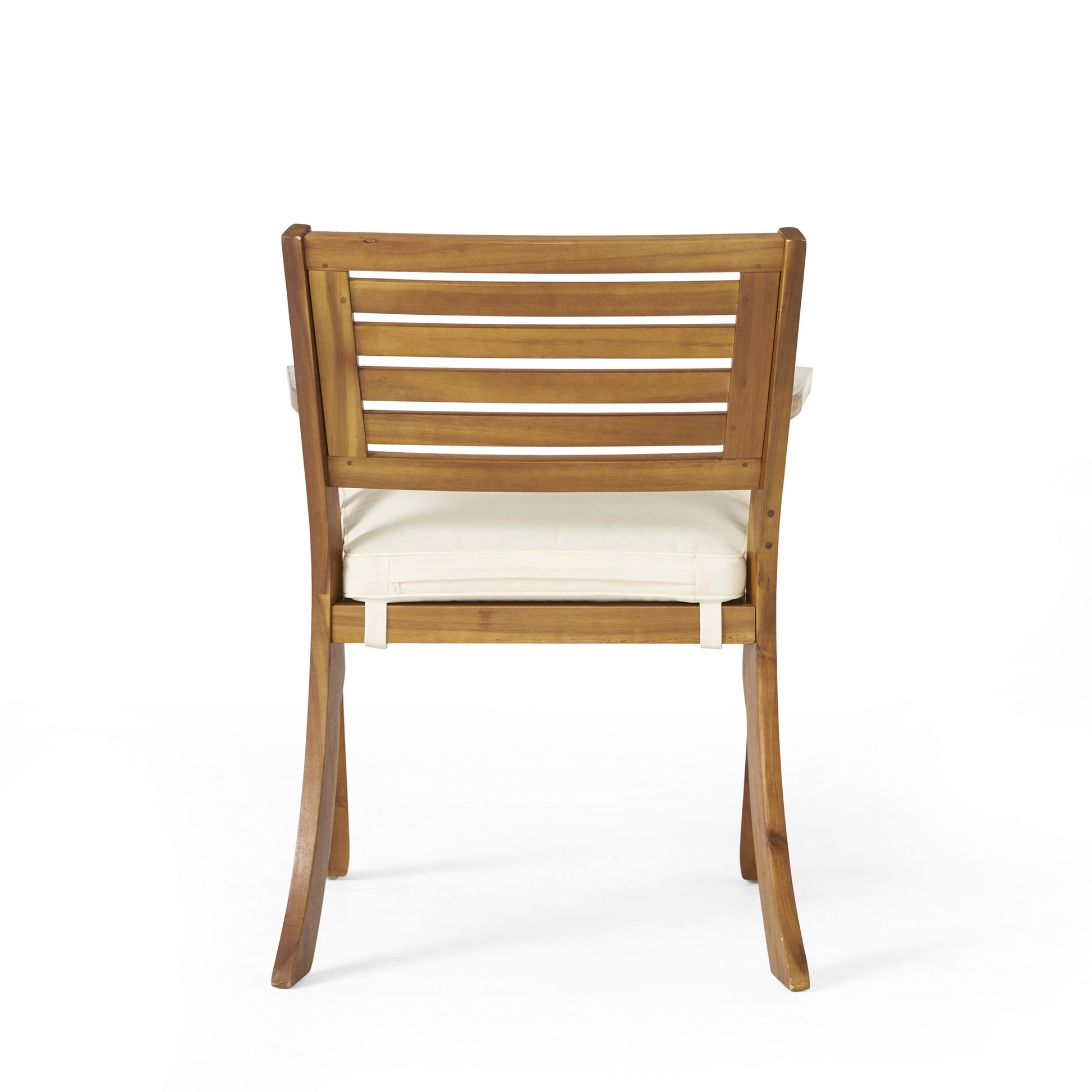 Wooden dining chair with slatted back and cream cushion for outdoor use
