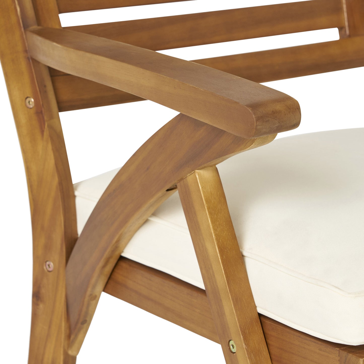 Closeup of a light beige cushion on a brown wooden outdoor chair highlighting its texture