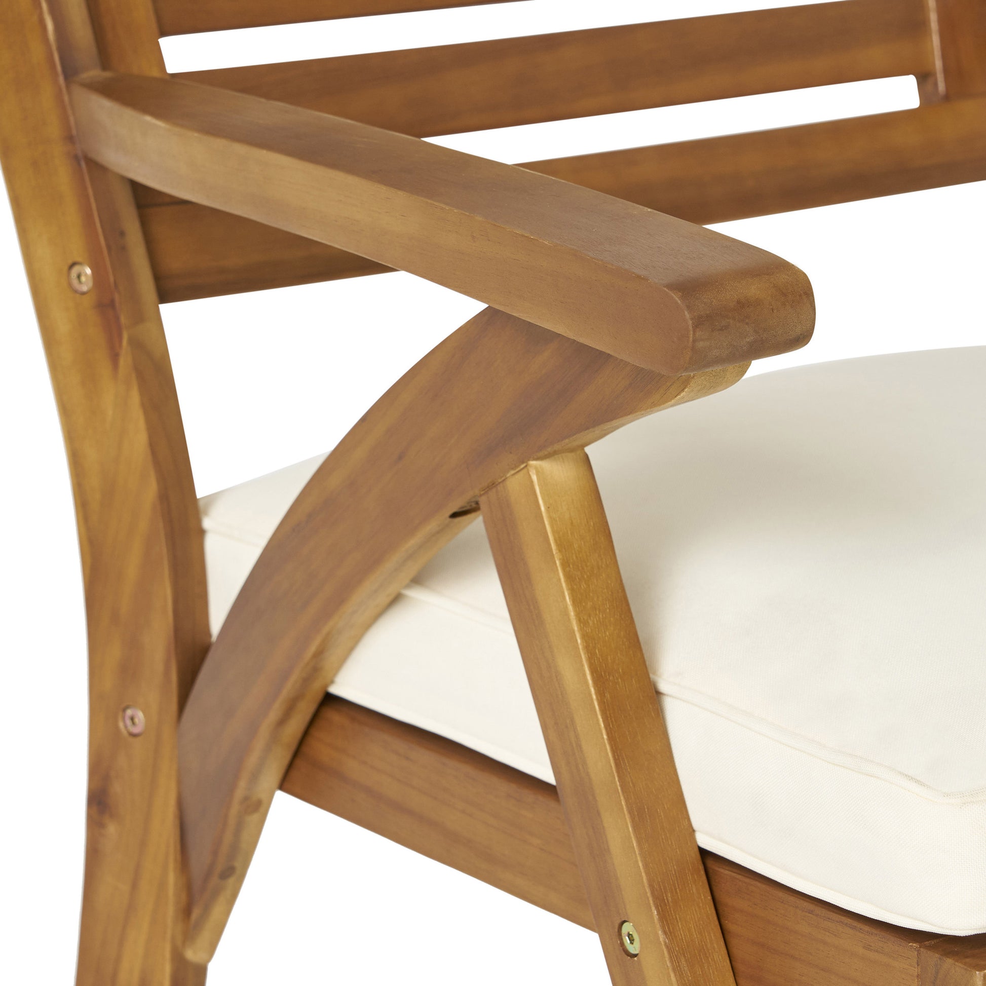 Closeup of a light beige cushion on a brown wooden outdoor chair highlighting its texture