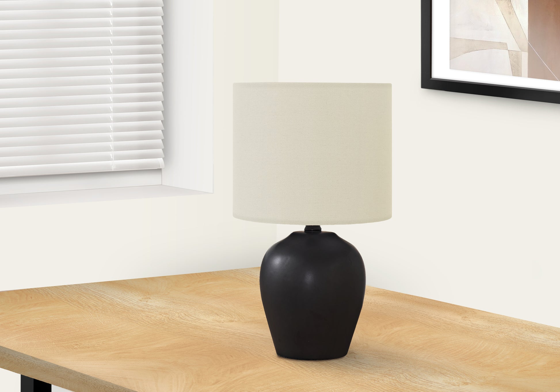 Matte black ceramic table lamp with cream linen shade ideal for bedside lighting