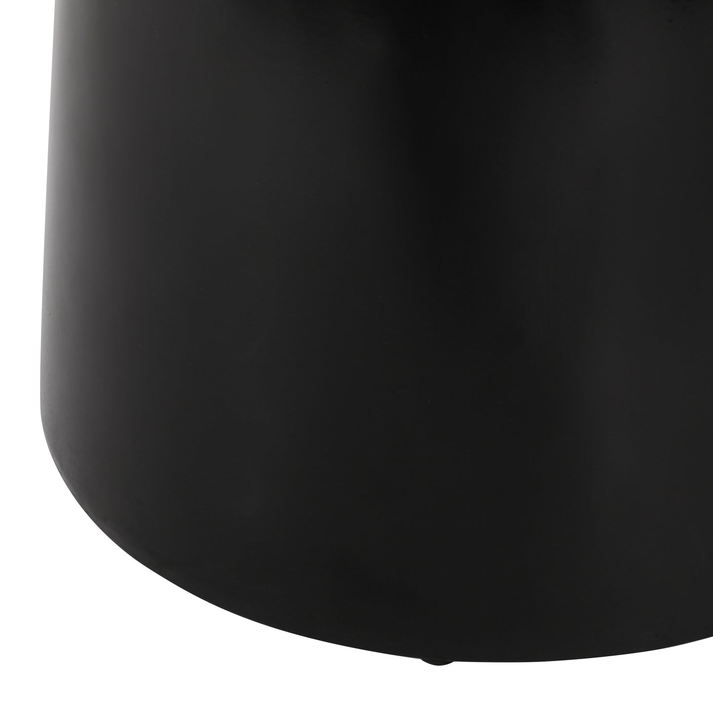Close up of a black metal cylinder vase showcasing its smooth matte finish and curved base