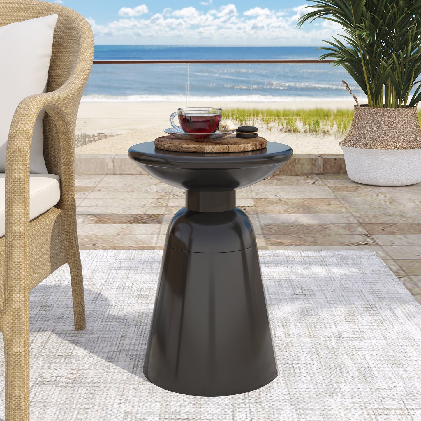 Sleek black modern side table with a glossy finish and sculptural base perfect for outdoor spaces