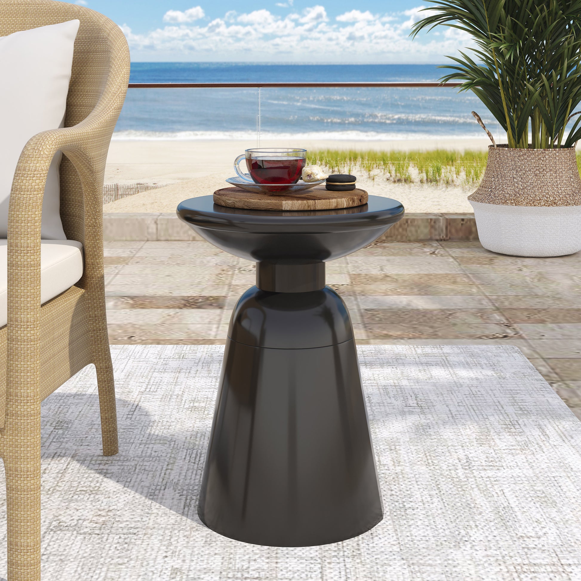 Sleek black modern side table with a glossy finish and sculptural base perfect for outdoor spaces