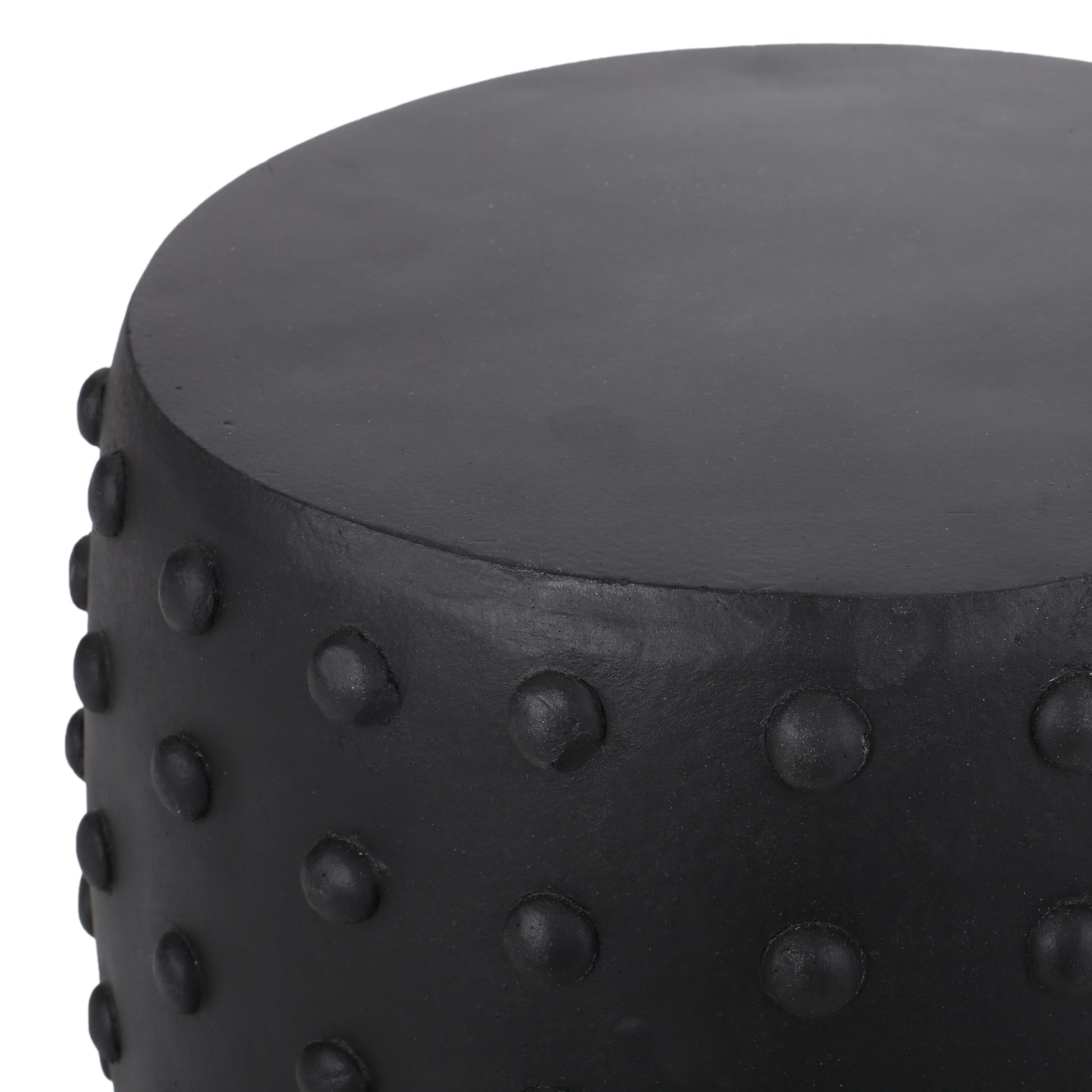 Black ceramic garden stool with raised dot pattern detail