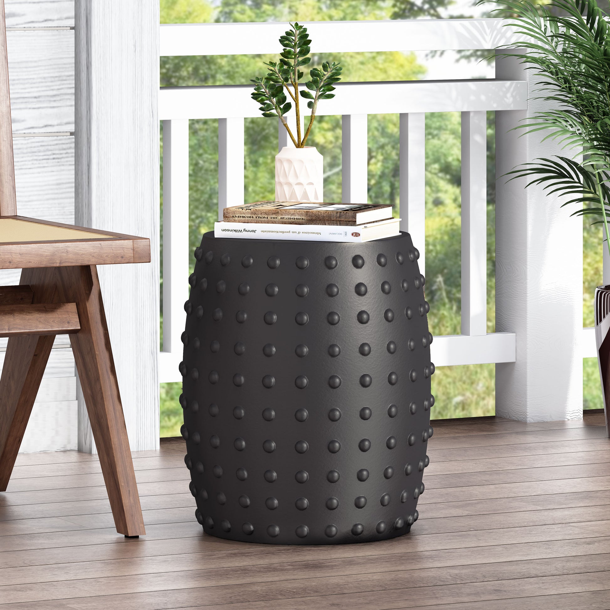 Black textured garden stool with studded details perfect for outdoor seating