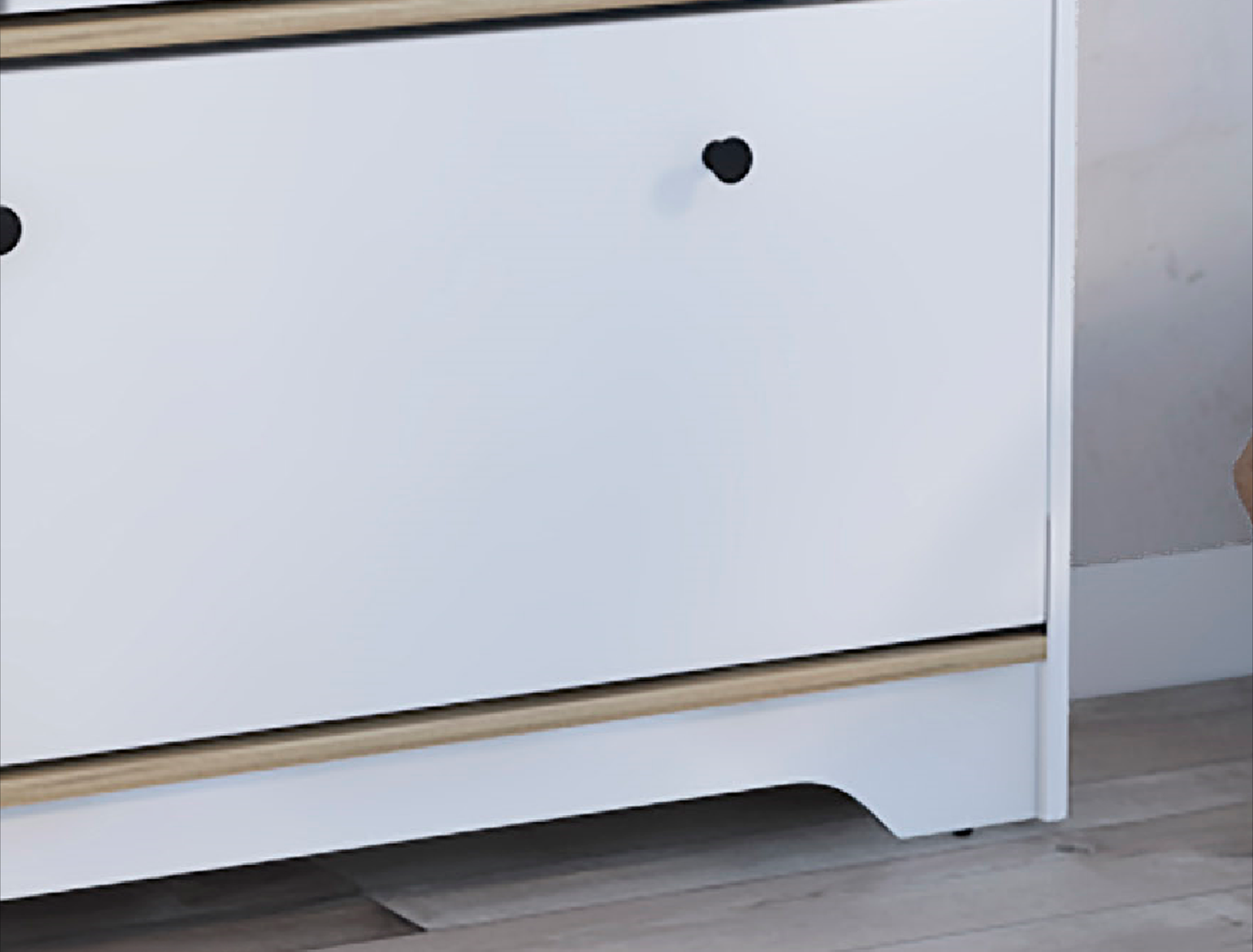White twodrawer cabinet with wood trim and black knobs
