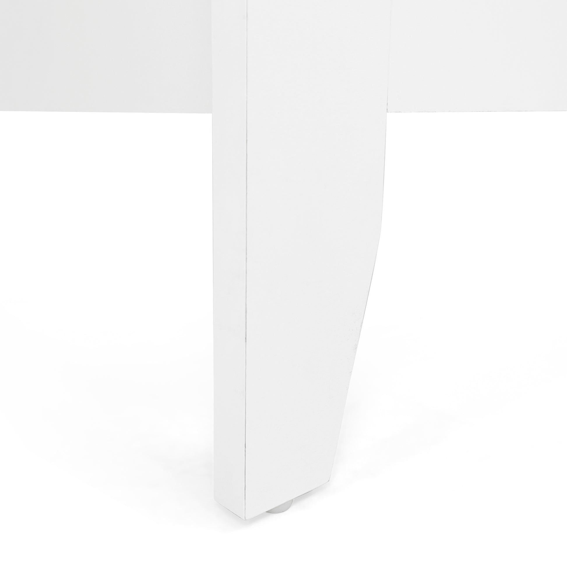Closeup of a white modern furniture leg with a rounded bottom edge and a small silver foot