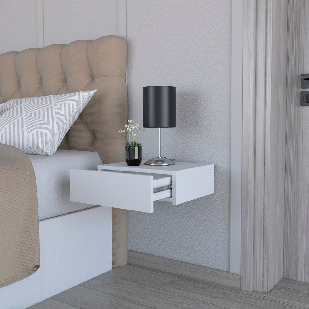 White wallmounted nightstand with an open drawer and modern black lamp
