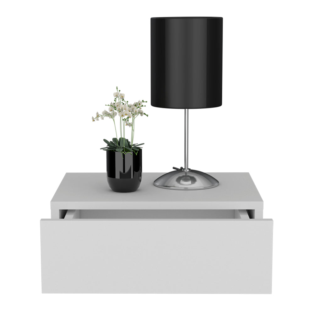 Black modern desk lamp with silver base on white floating shelf