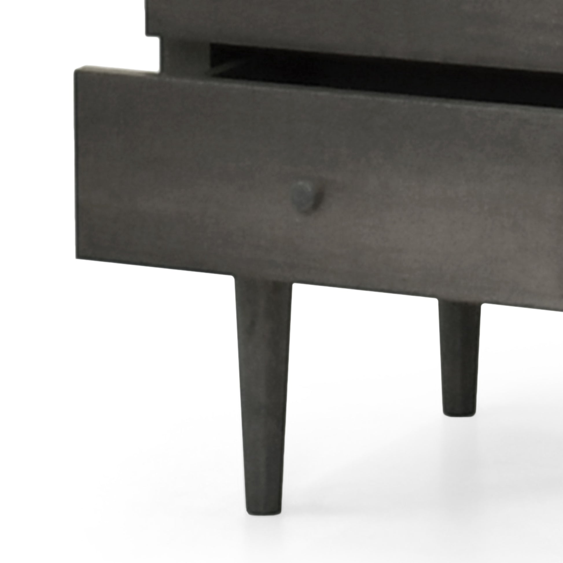 Dark gray wooden dresser drawer detail with tapered legs