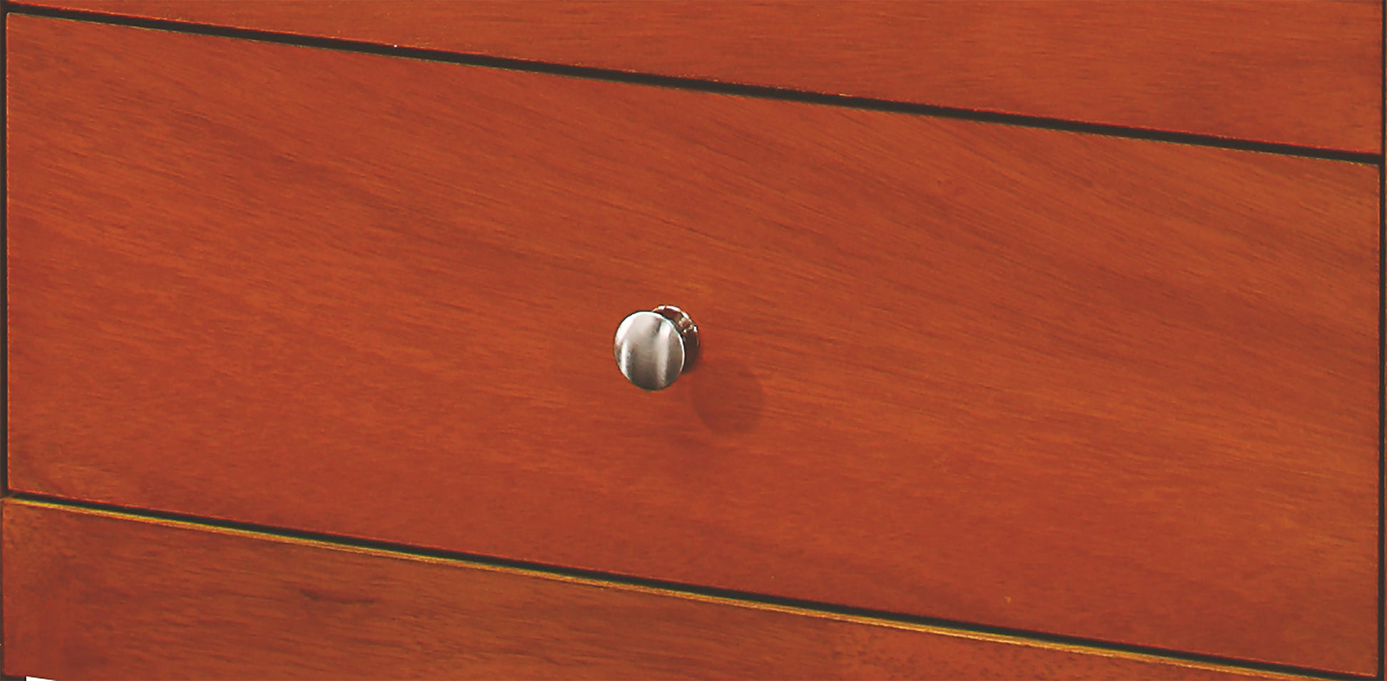 Detail of a cherry wood drawer with a brushed nickel knob