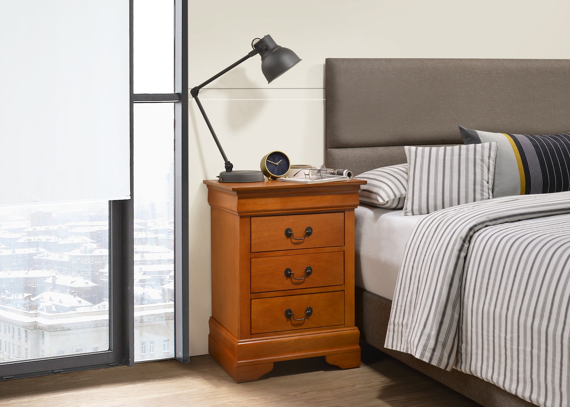 Elegant cherry wood nightstand with three drawers and ornate hardware perfect for bedroom storage