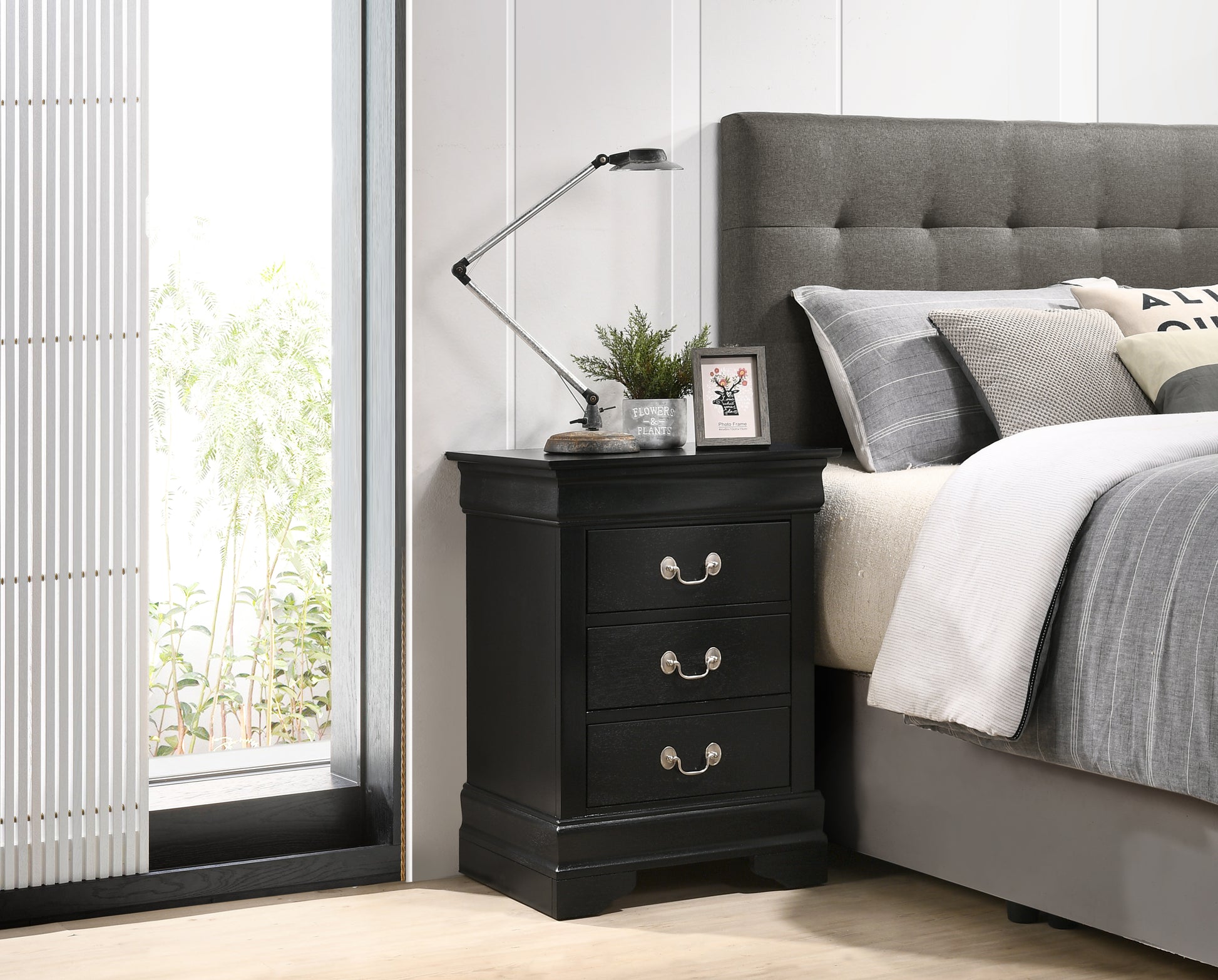 Classic black wood nightstand with three drawers and silver hardware