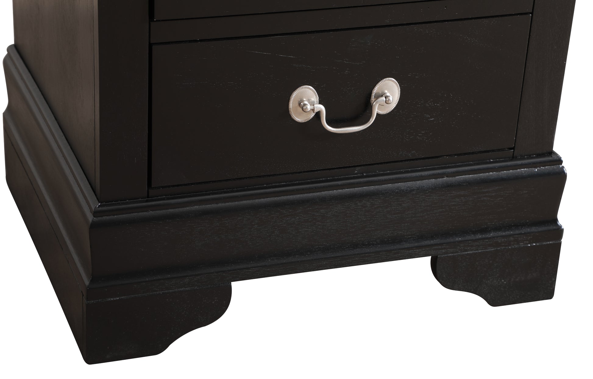 Black wooden dresser drawer with ornate silver pull classic design