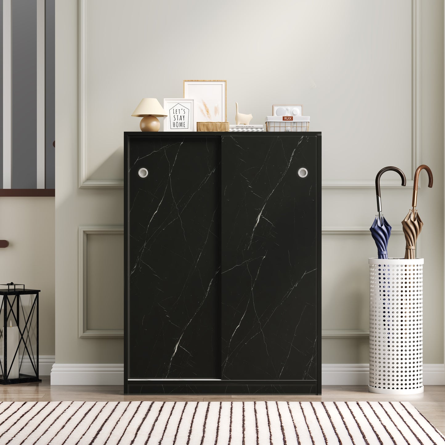 Sleek black marble effect cabinet with sliding doors for modern storage