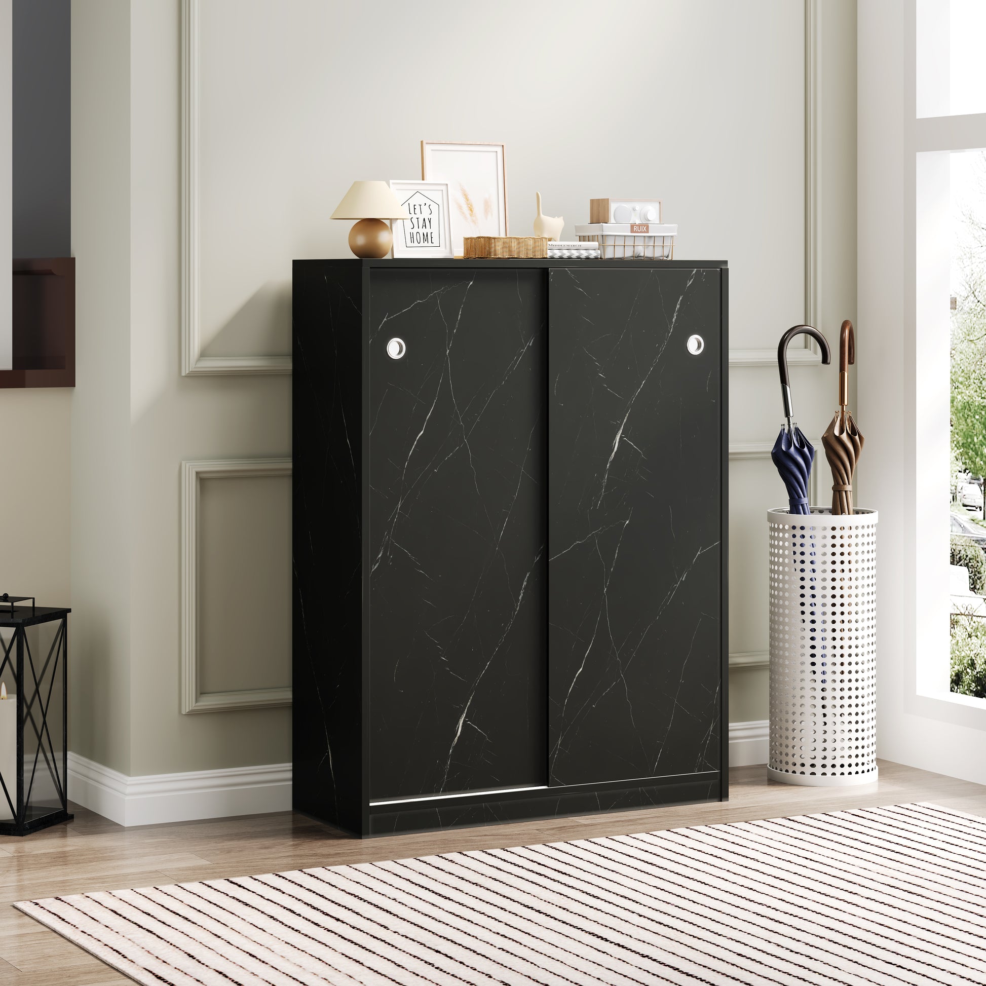 Black marble sliding door cabinet with silver handles perfect for modern entryways