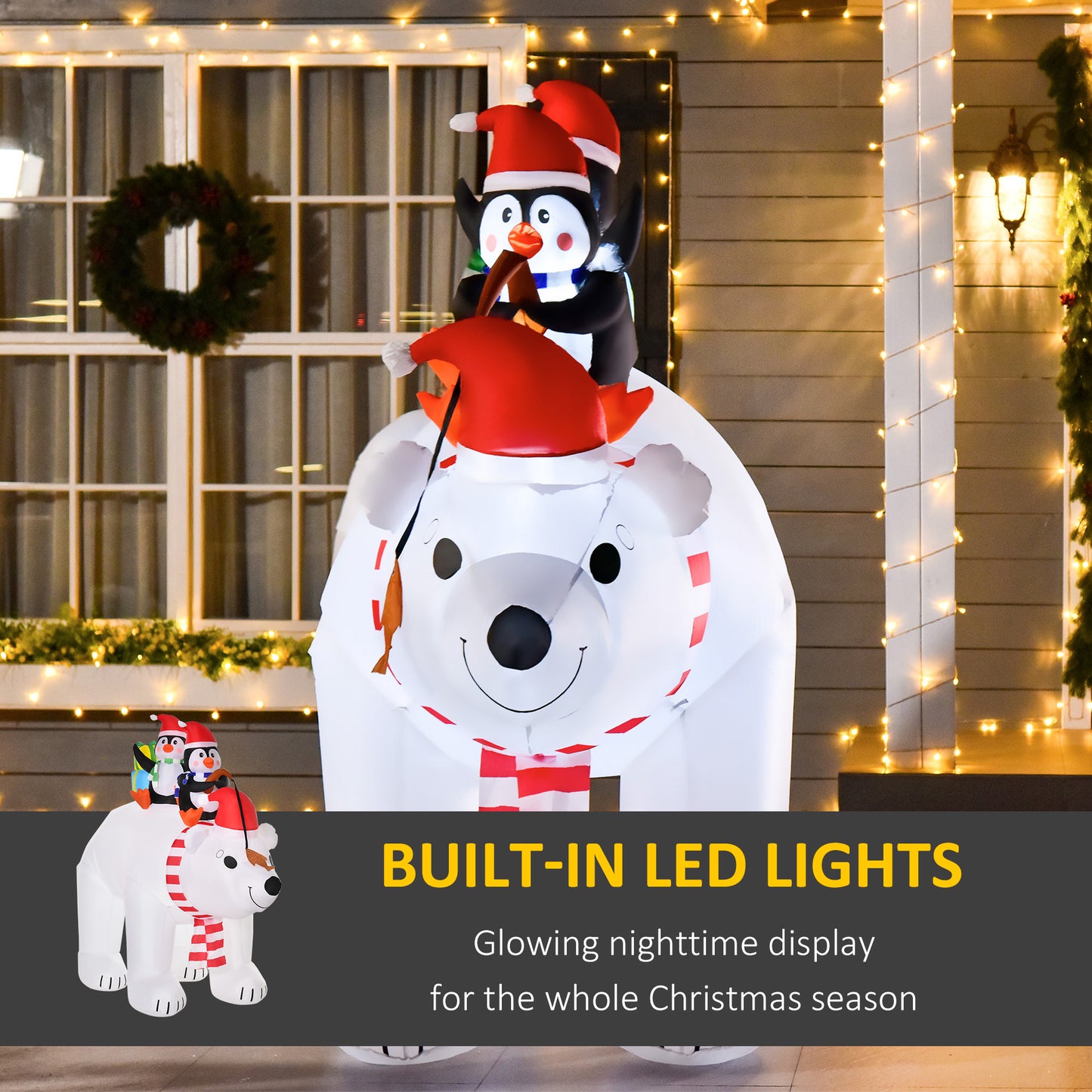 White inflatable polar bear with penguins on top dressed for Christmas