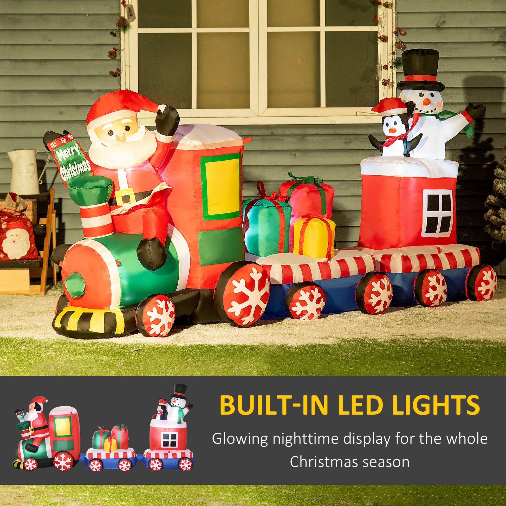 Inflatable Santa Claus Christmas train with a snowman and penguin on top