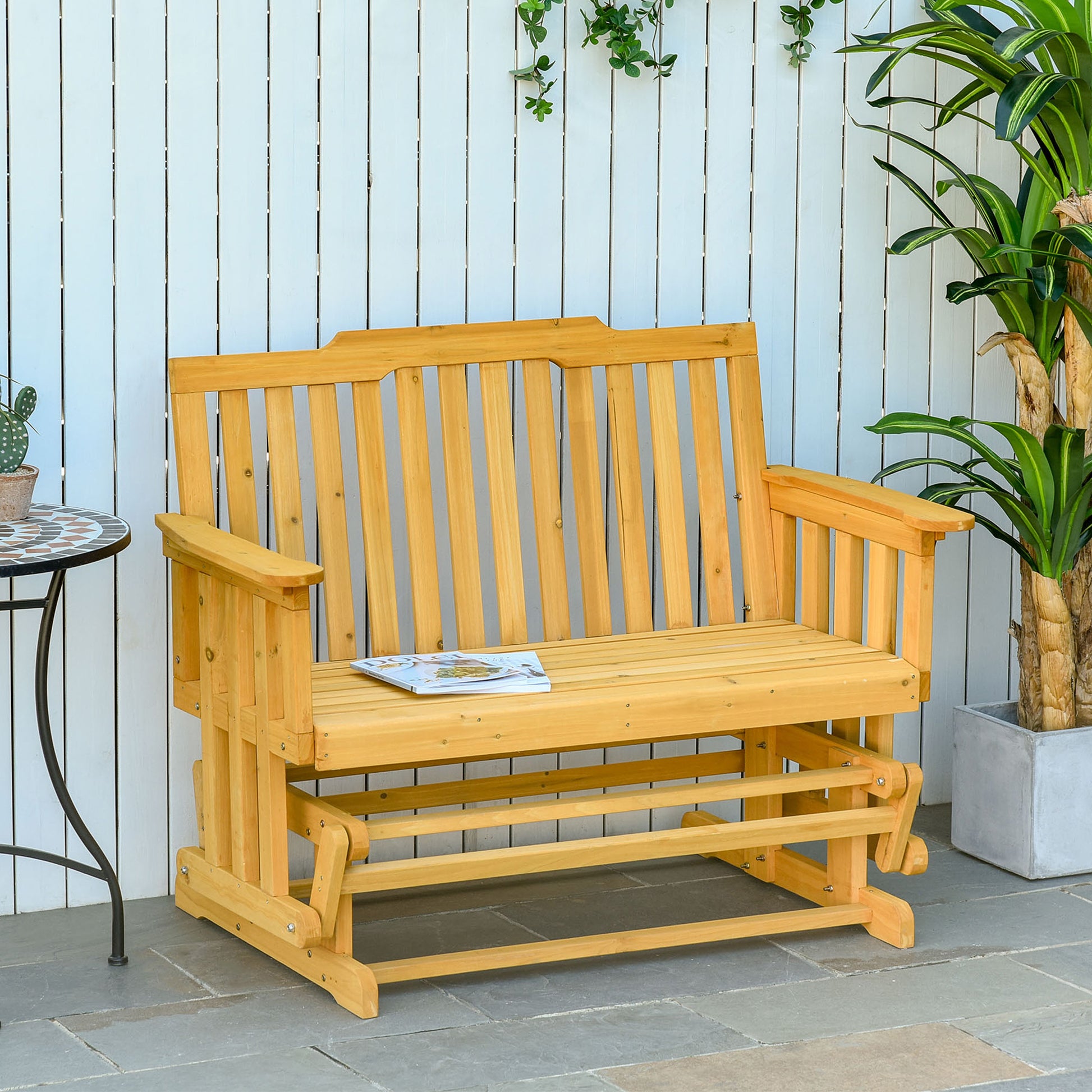 Natural wood glider bench with slatted back and seat perfect for patio relaxation