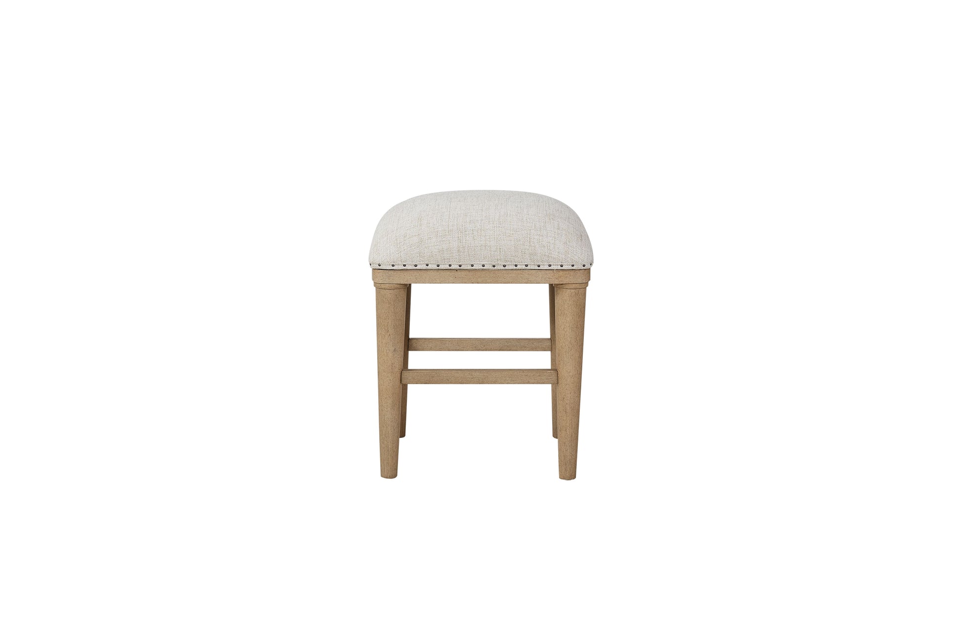 Upholstered cream fabric bar stool with natural wood legs and nailhead trim