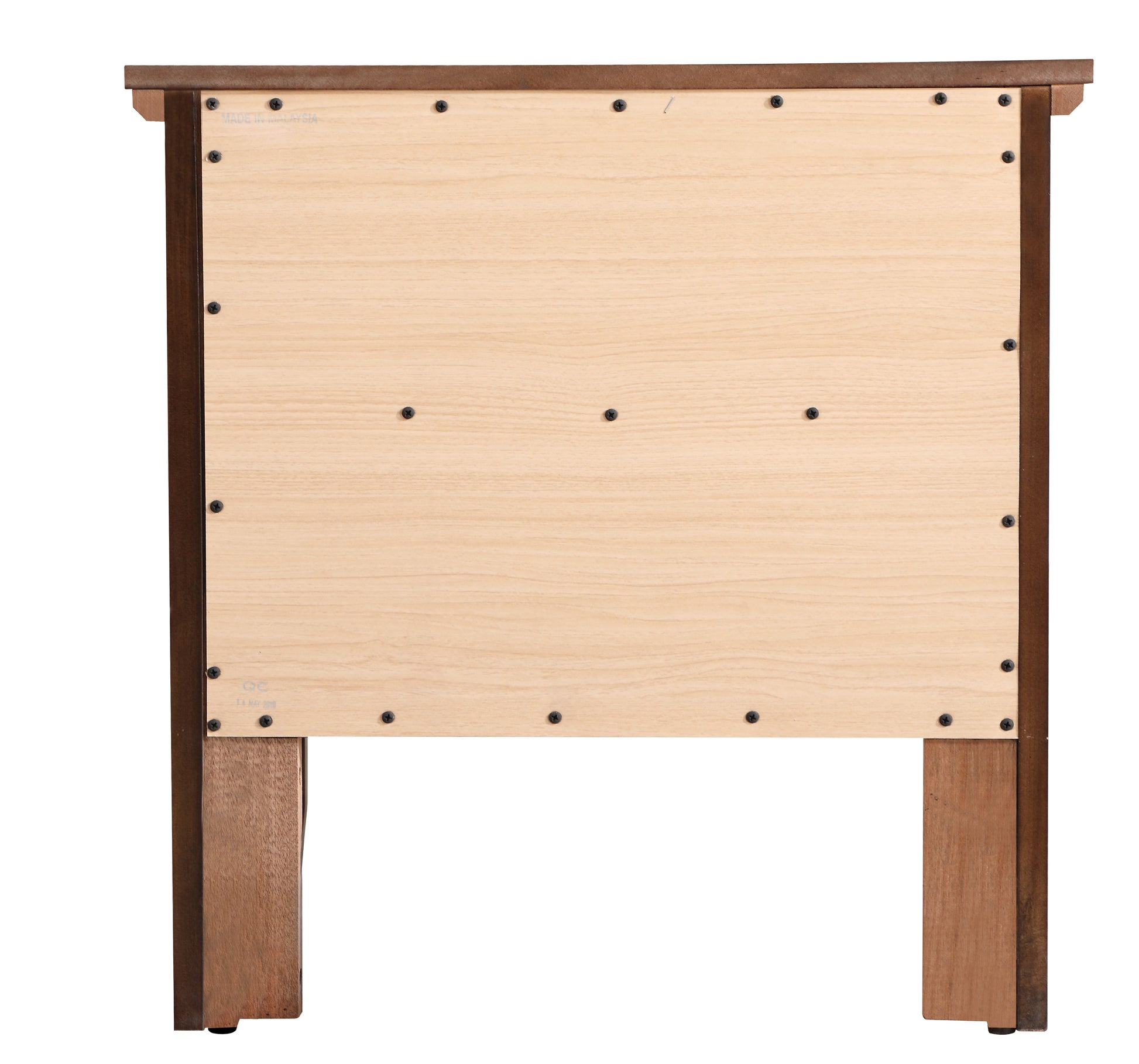Back view of a light wood particleboard nightstand panel with dark wood frame and screws