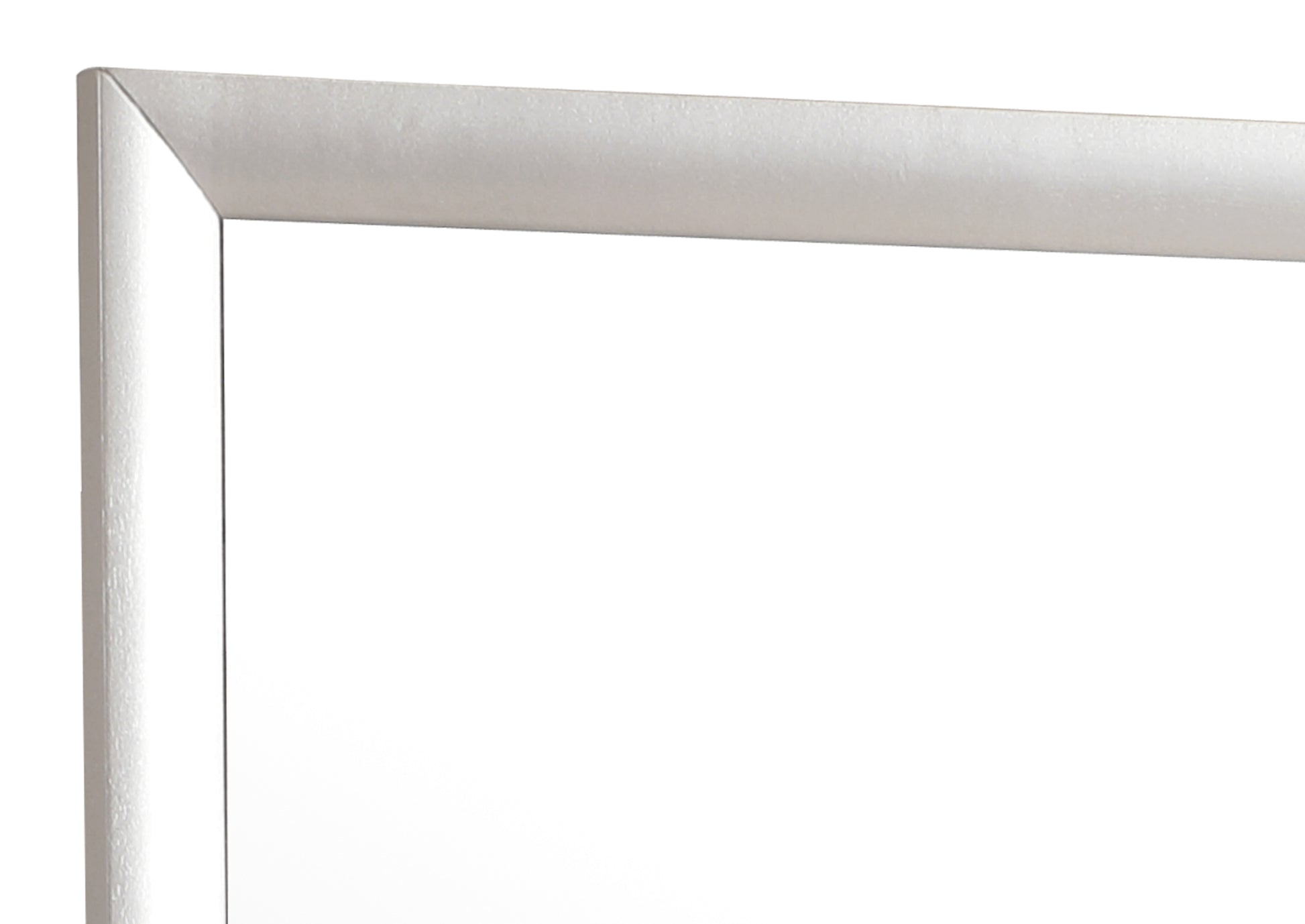 Closeup of a brushed silver metal picture frame corner showcasing its clean lines